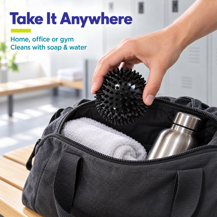 Packing a black spiky massage ball in a gym bag; use at home, office or gym, cleans with soap and water