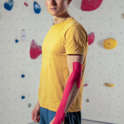 Leukotape K red kinesiology tape arm application