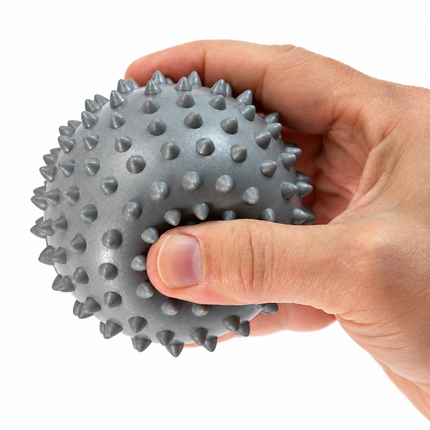 Medium gray 9 cm spiky massage ball in hand